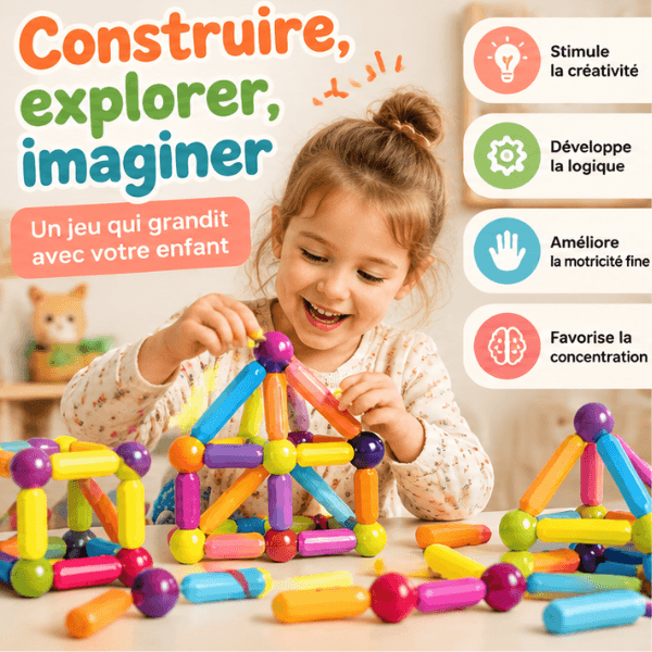 Petite fille construisant une maison avec les pièces magnétiques